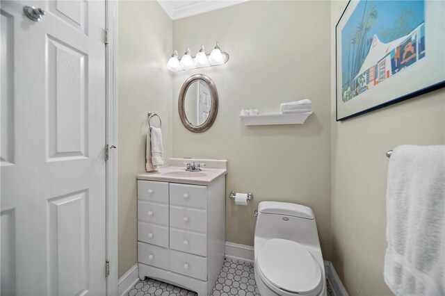 10756 Aldina Dr, Conneaut Lake, PA 16316 - bathroom featuring vanity, baseboards, toilet, and ornamental molding