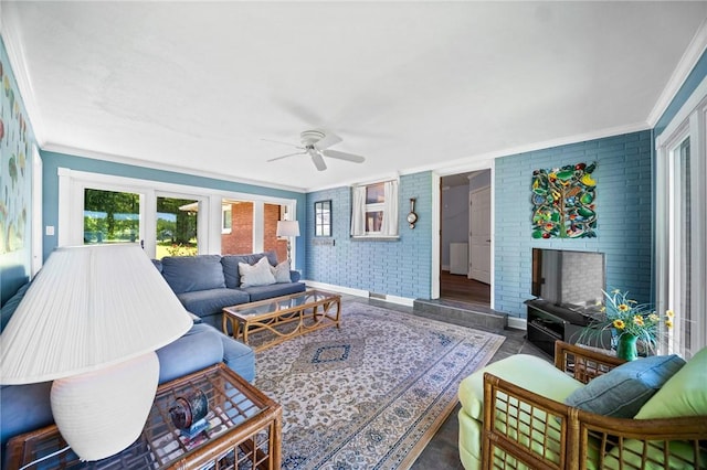 10756 Aldina Dr, Conneaut Lake, PA 16316 - living area featuring crown molding, ceiling fan, brick wall, and baseboards