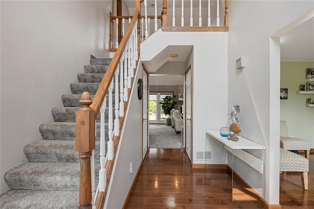 3893 Windsor Ct, Hermitage, PA 16148 - staircase with hardwood / wood-style flooring, baseboards, and a towering ceiling