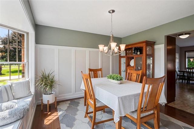 3893 Windsor Ct, Hermitage, PA 16148 - dining space with a chandelier, light wood-style flooring, and a decorative wall