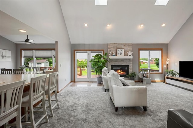 3893 Windsor Ct, Hermitage, PA 16148 - living room featuring carpet, vaulted ceiling, plenty of natural light, a stone fireplace, and recessed lighting