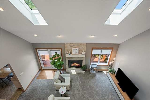 3893 Windsor Ct, Hermitage, PA 16148 - carpeted living room featuring a skylight, a fireplace, baseboards, and recessed lighting