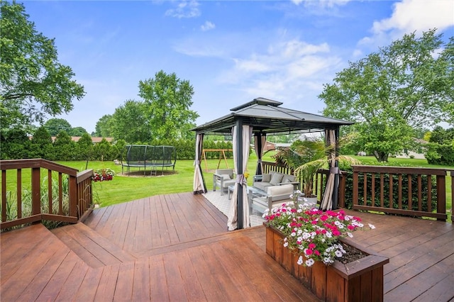 3893 Windsor Ct, Hermitage, PA 16148 - deck featuring a trampoline, a gazebo, a lawn, and outdoor lounge area