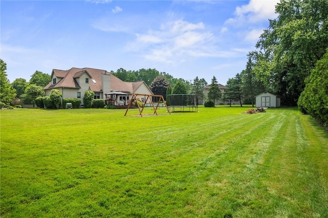 3893 Windsor Ct, Hermitage, PA 16148 - view of green lawn featuring a trampoline and a playground