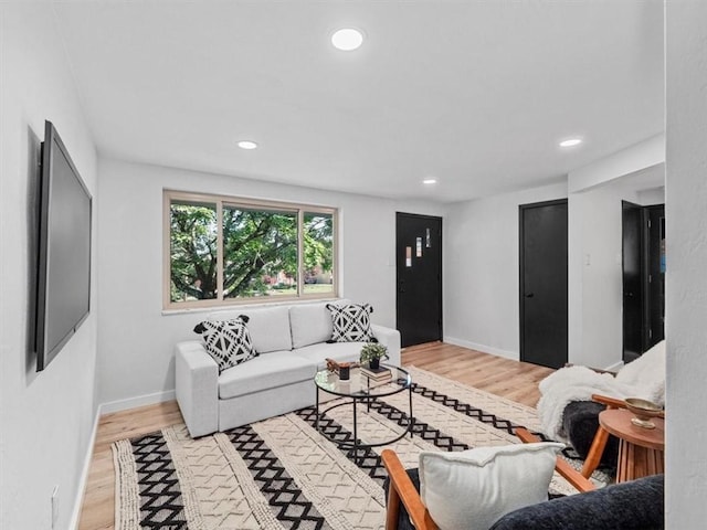 612 Blossom Dr, Baldwin Boro, PA 15236 - living room featuring light wood-type flooring, recessed lighting, and baseboards
