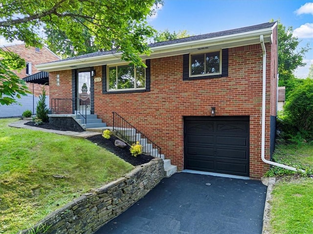 612 Blossom Dr, Baldwin Boro, PA 15236 - view of front of home with a garage, a front yard, driveway, and brick siding