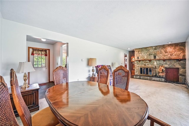 1011 S Lake Rd, Jefferson Twp Mer, PA 16137 - carpeted dining space featuring a stone fireplace