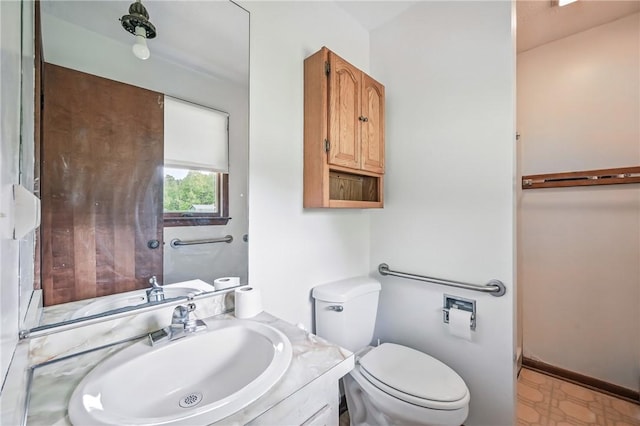 1011 S Lake Rd, Jefferson Twp Mer, PA 16137 - half bathroom with toilet, vanity, and tile patterned floors