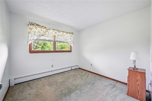 1011 S Lake Rd, Jefferson Twp Mer, PA 16137 - empty room featuring a baseboard radiator, carpet floors, and baseboards