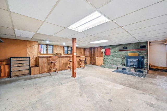1011 S Lake Rd, Jefferson Twp Mer, PA 16137 - basement featuring a wood stove, a dry bar, and a drop ceiling