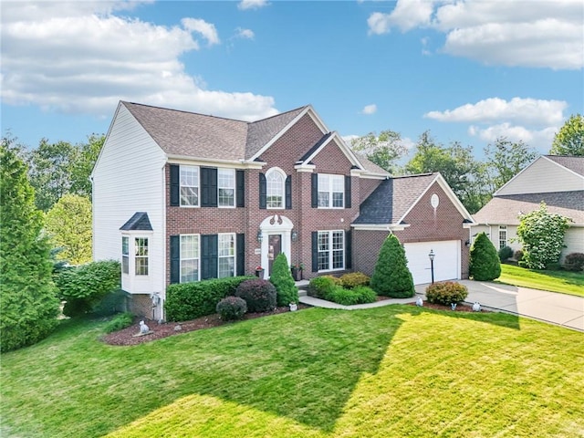 4324 Grandview Dr, Richland, PA 15044 - view of front of home with concrete driveway, a front yard, an attached garage, brick siding, and roof with shingles