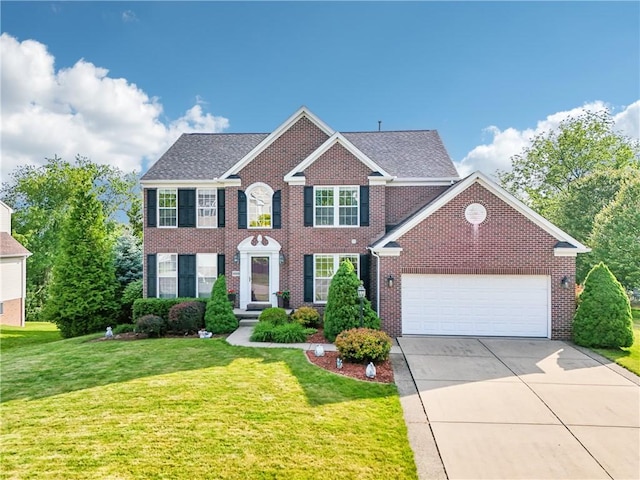 4324 Grandview Dr, Richland, PA 15044 - colonial home featuring driveway, brick siding, a front lawn, a garage, and roof with shingles