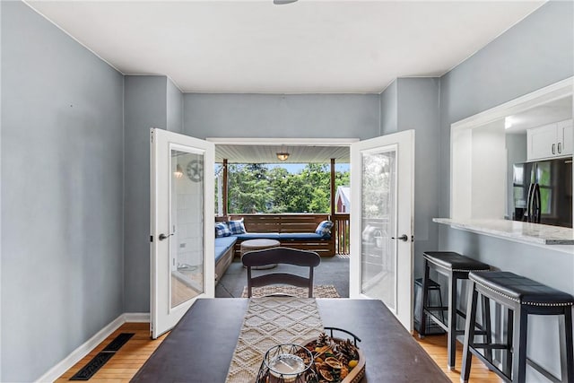2693 Crosby Ave, Dormont, PA 15216 - dining space with french doors, light wood-type flooring, and baseboards