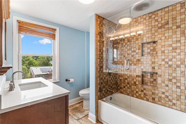 2693 Crosby Ave, Dormont, PA 15216 - full bath with toilet, vanity, shower / bath combination with glass door, and baseboards