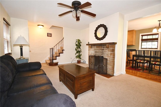 21 Leon Rd, Green Tree, PA 15220 - living area with ceiling fan, light colored carpet, a fireplace, and stairs