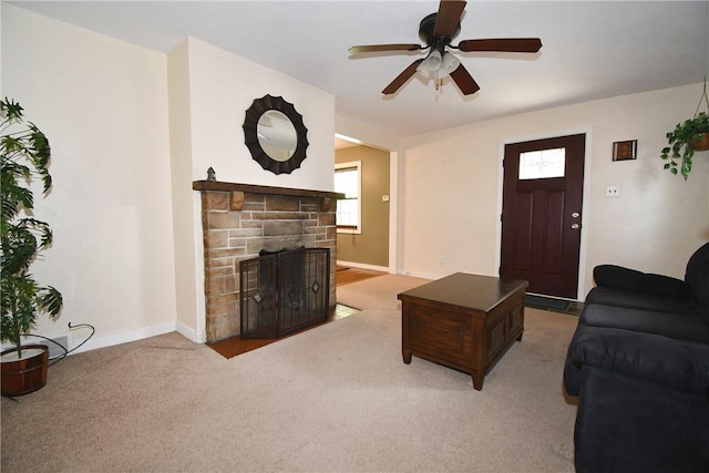 21 Leon Rd, Green Tree, PA 15220 - living room with a ceiling fan, a stone fireplace, baseboards, and light carpet