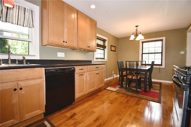 21 Leon Rd, Green Tree, PA 15220 - kitchen featuring black dishwasher, light wood-type flooring, a chandelier, gas stove, and dark countertops