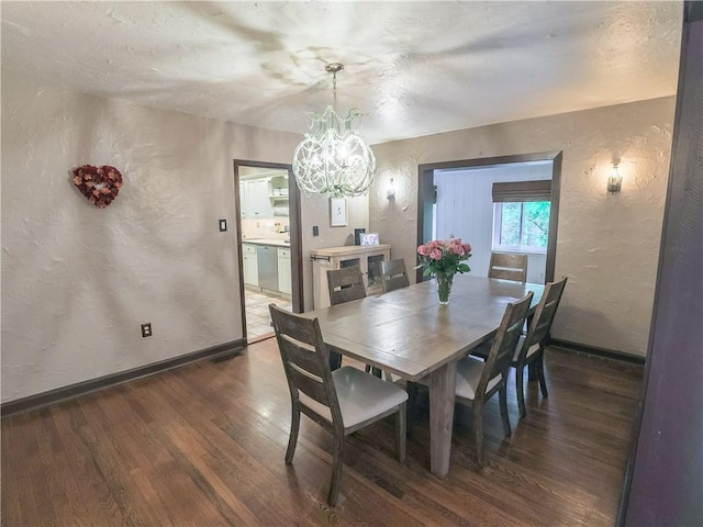464 Avon Dr, Mt Lebanon, PA 15228 - dining room with a textured wall, wood finished floors, a chandelier, and baseboards