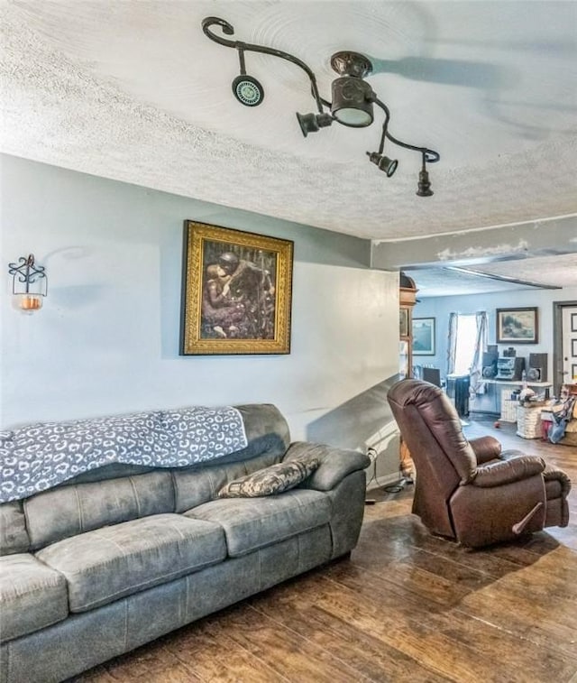 148 Falls Rd, Pa, PA 16314 - living room featuring a textured ceiling and wood finished floors