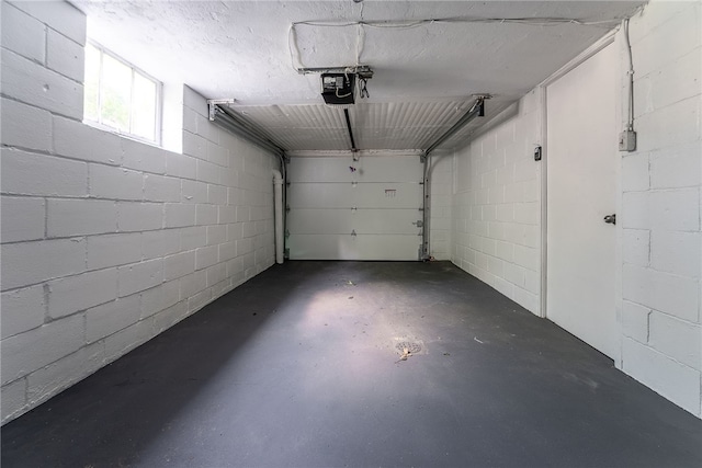 1416 Swantek St, Sheraden, PA 15204 - garage featuring a garage door opener and concrete block wall