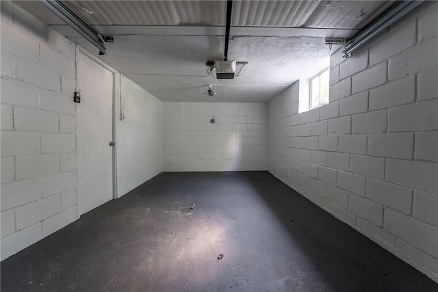 1416 Swantek St, Sheraden, PA 15204 - garage featuring a garage door opener and concrete block wall