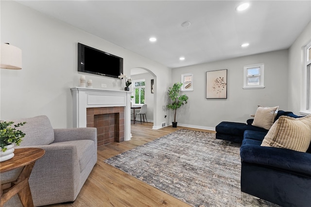 1416 Swantek St, Sheraden, PA 15204 - living room with arched walkways, recessed lighting, light wood-style floors, a fireplace, and baseboards