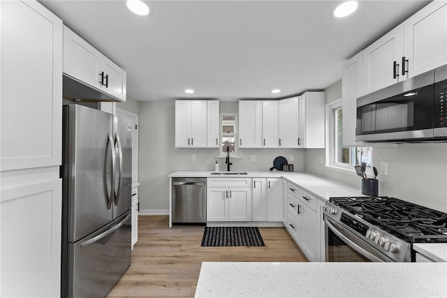 1416 Swantek St, Sheraden, PA 15204 - kitchen featuring stainless steel appliances, a sink, recessed lighting, and light countertops