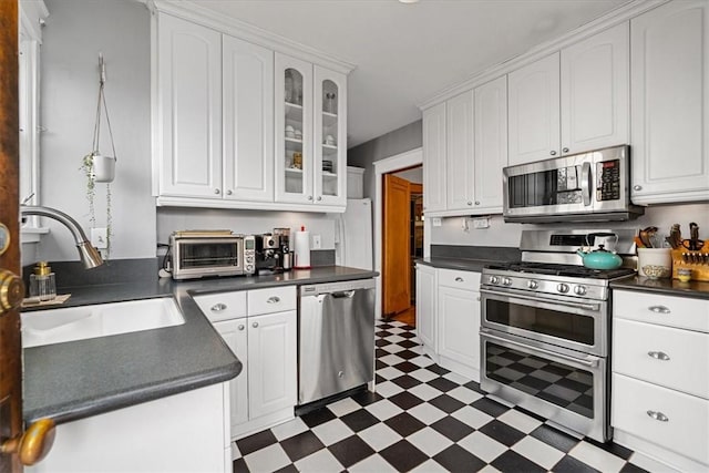 2352 Beaufort Ave, Brookline, PA 15226 - kitchen featuring appliances with stainless steel finishes, dark floors, a sink, and dark countertops