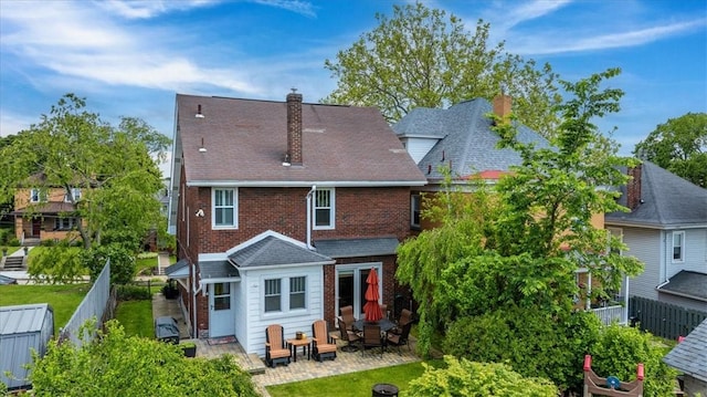 2352 Beaufort Ave, Brookline, PA 15226 - rear view of house with a fenced backyard, a patio area, a chimney, and brick siding