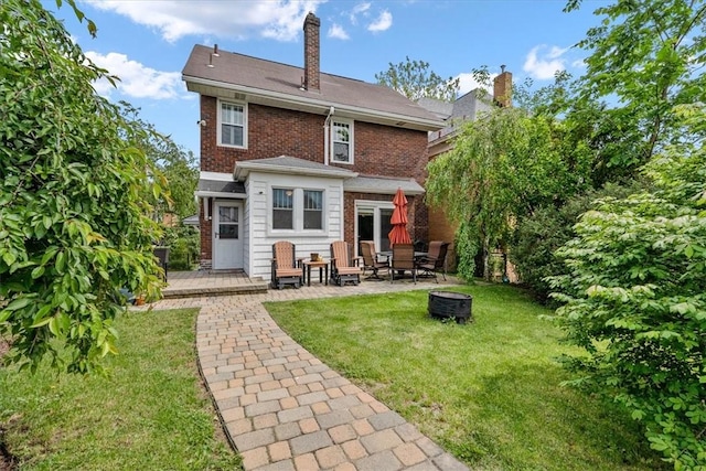 2352 Beaufort Ave, Brookline, PA 15226 - back of house featuring a yard, a patio, an outdoor fire pit, a wooden deck, and brick siding
