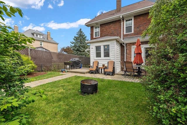 2352 Beaufort Ave, Brookline, PA 15226 - rear view of house with a patio, brick siding, and an outdoor fire pit