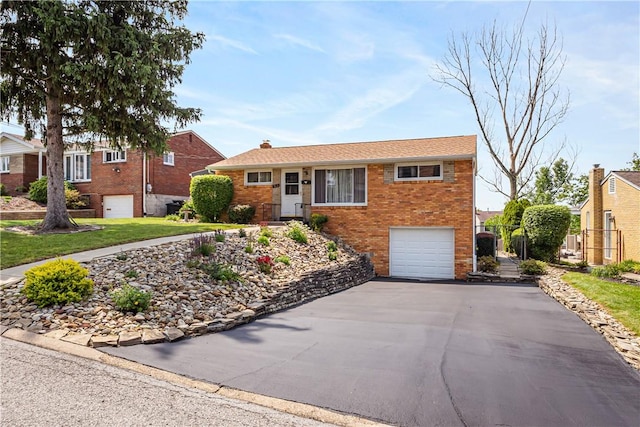 513 Elaine Dr, Baldwin Boro, PA 15236 - ranch-style home featuring driveway, an attached garage, and brick siding