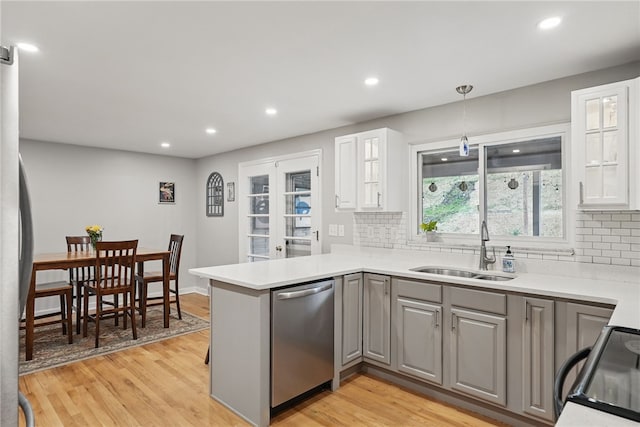 1450 Mohican Dr, Mt Lebanon, PA 15228 - kitchen with stainless steel appliances, a sink, gray cabinets, tasteful backsplash, and recessed lighting