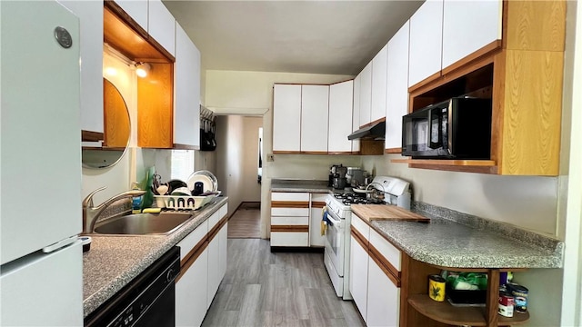 5427 Bartlett St, Squirrel Hill, PA 15217 - kitchen with black appliances, a sink, white cabinetry, light wood-type flooring, and under cabinet range hood