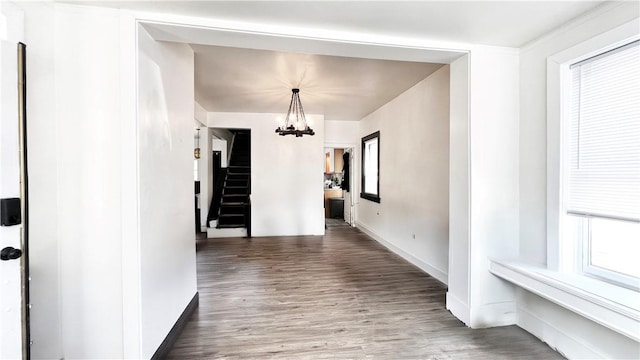 5427 Bartlett St, Squirrel Hill, PA 15217 - unfurnished dining area featuring a chandelier, wood finished floors, and baseboards