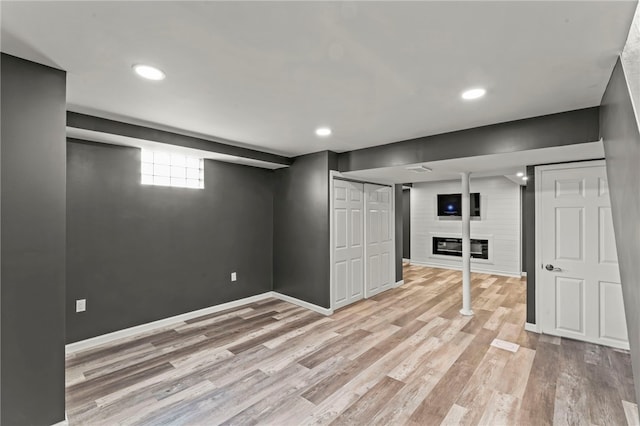 5360 California Ave, Bethel Park, PA 15102 - basement with light wood-style flooring, a fireplace, recessed lighting, and baseboards