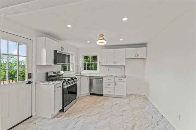 5360 California Ave, Bethel Park, PA 15102 - kitchen featuring stainless steel appliances, a sink, white cabinetry, tasteful backsplash, and recessed lighting