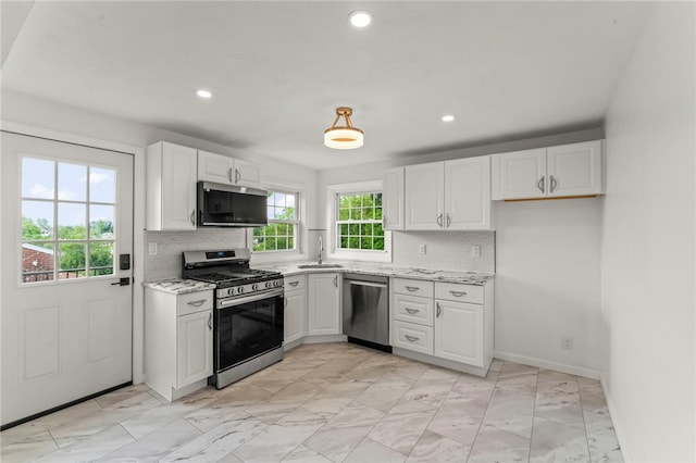 5360 California Ave, Bethel Park, PA 15102 - kitchen featuring appliances with stainless steel finishes, a sink, white cabinets, backsplash, and recessed lighting