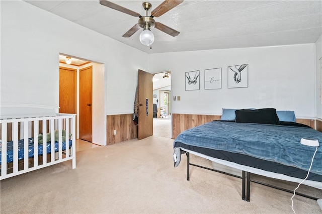 4041 Second St, Hempfield Twp Wml, PA 15642 - carpeted bedroom with wainscoting, wood walls, and a ceiling fan