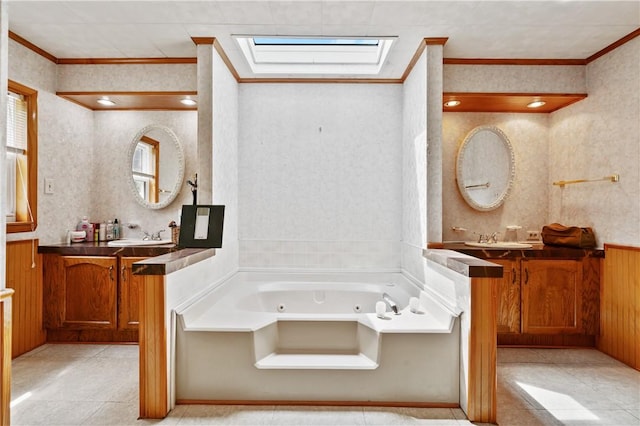 4041 Second St, Hempfield Twp Wml, PA 15642 - bathroom featuring crown molding, a tub with jets, two vanities, tile patterned flooring, and wallpapered walls