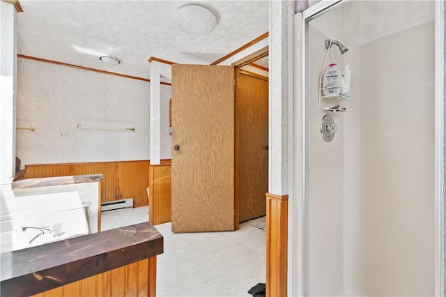 4041 Second St, Hempfield Twp Wml, PA 15642 - bathroom featuring a wainscoted wall, a baseboard radiator, a shower, and wood walls