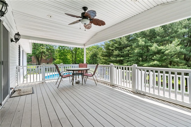 4041 Second St, Hempfield Twp Wml, PA 15642 - deck with a ceiling fan, outdoor dining area, and view of scattered trees