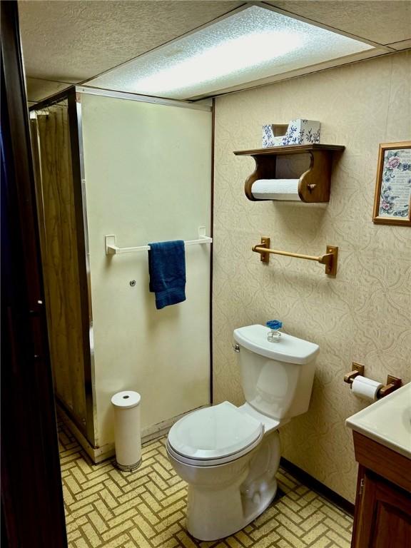 114 Tillotson Cir, Ross Twp, PA 15237 - bathroom featuring brick patterned floors, toilet, vanity, and baseboards