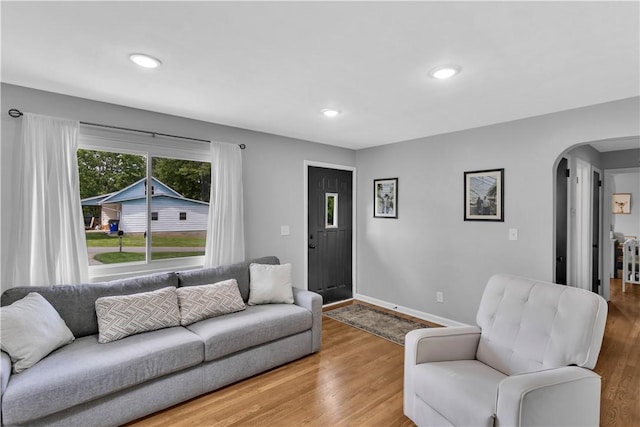 310 Hutter Ave, North Sewickley Twp, PA 16117 - living area with arched walkways, wood finished floors, baseboards, and recessed lighting