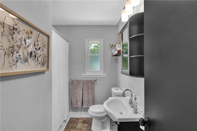 310 Hutter Ave, North Sewickley Twp, PA 16117 - bathroom with toilet, stone finish flooring, vanity, baseboards, and curtained shower