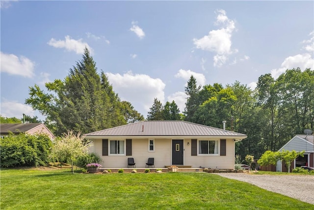 310 Hutter Ave, North Sewickley Twp, PA 16117 - view of front of home with metal roof, a front yard, and gravel driveway