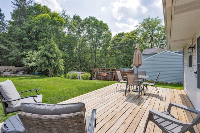 310 Hutter Ave, North Sewickley Twp, PA 16117 - deck featuring outdoor dining area, a lawn, and a playground