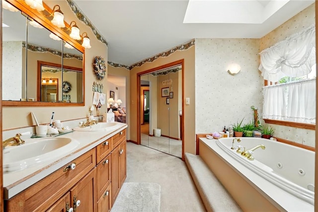 79 Mariacher Rd, Findley Twp, PA 16137 - bathroom with a skylight, double vanity, a tub with jets, and wallpapered walls