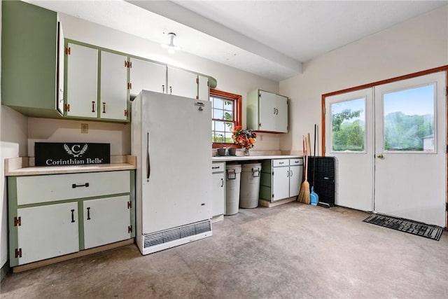 79 Mariacher Rd, Findley Twp, PA 16137 - kitchen with freestanding refrigerator, concrete flooring, light countertops, and green cabinetry