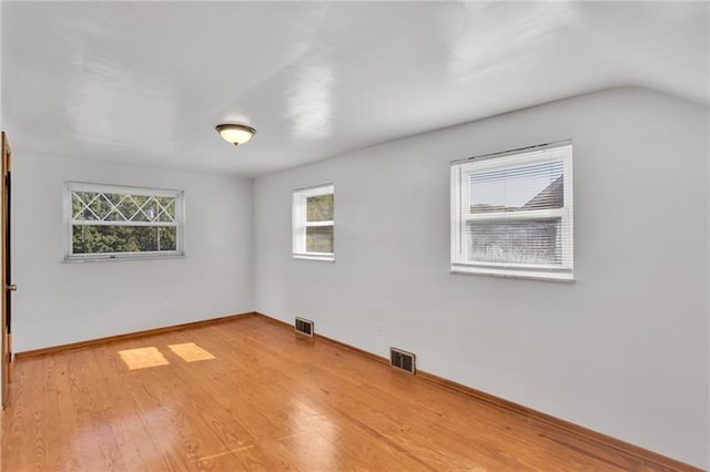 427 Cedar St, Jeannette, PA 15644 - spare room with healthy amount of natural light, light wood finished floors, baseboards, and vaulted ceiling